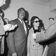 In this photo dated May 21, 1964, then 29-year-old Abraham Bolden was a suspended U.S. secret service agent. He walked with his wife before he was indicted on charges of offering to sell secret government documents to an underworld figure for $50,000. He was convicted in 1966. Today, President Joe Biden pardoned him.